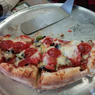 Unlimited toppings on 13 inch hand tossed wood fired pizza for $8 oj Tuesdays. A real barhgain.