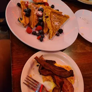 French toast,  scrambled eggs with cheese and bacon