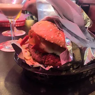 a hamburger wrapped in foil