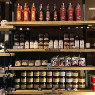 shelves full of chili sauces