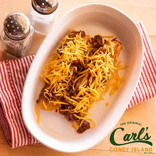 Grab a tamale lunch today! Two Shredded Beef Tamales topped with Carl's Famous Chili and Shredded Cheddar Cheese