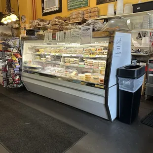 a deli counter with a variety of pastries
