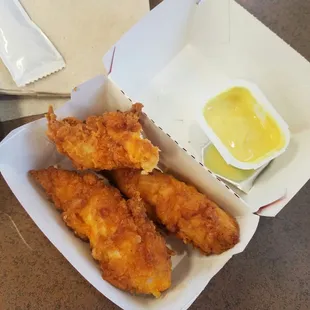 a basket of fried chicken strips