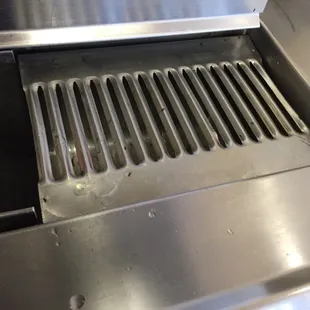 Picture of dead ants on the soda dispenser area. Live ants were walking all over the area too.