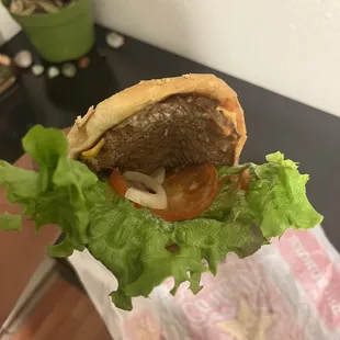 a hamburger with lettuce and tomato
