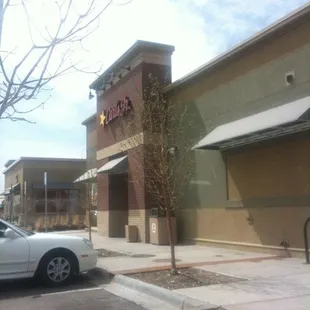 a car parked in front of a restaurant