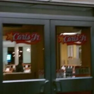 the reflection of a restaurant door