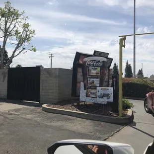 a coca cola advertisement on the side of a building