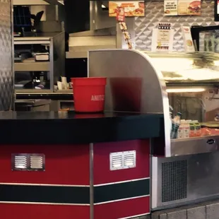 Bucket of "anitizer" on the counter where food is handled... Gross!