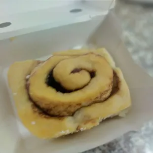 a cinnamon roll in a box