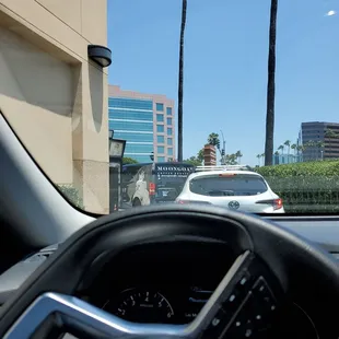 a view of a car driving down the street