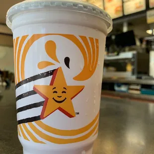 a starbucks cup with a smiley face on it