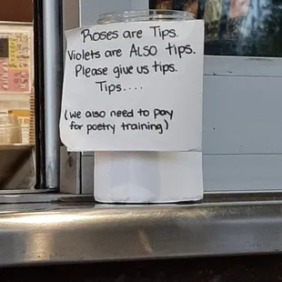 a sign posted on a window