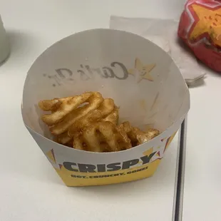 a basket of waffle fries