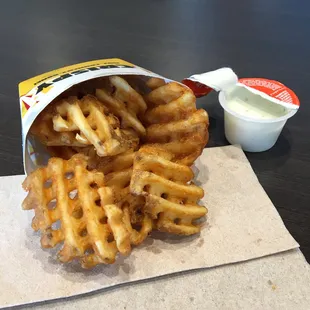 a bag of fried waffles and a cup of yogurt