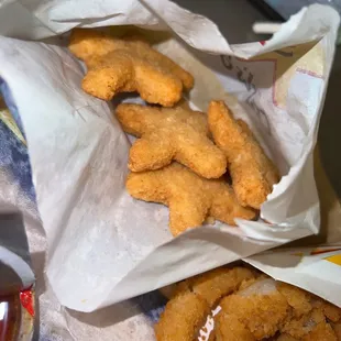 fried onion rings in a paper bag