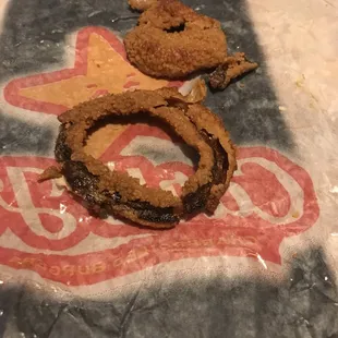 The extremely burnt and hard as a rock onion rings that were on my western bacon burger