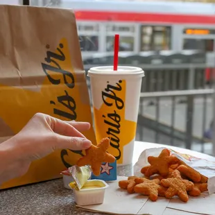 a person eating chicken nuggies
