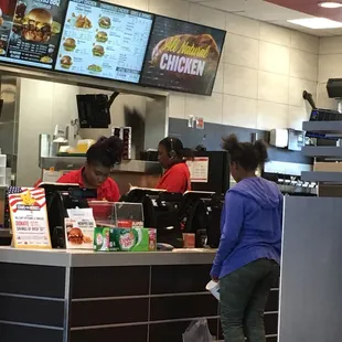 a woman ordering food at a restaurant