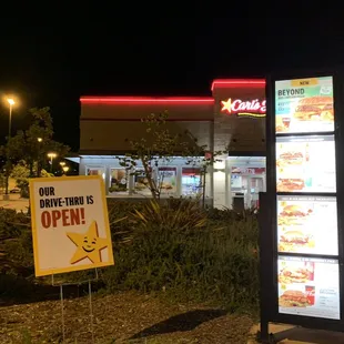 a sign in front of a restaurant