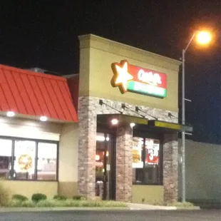 the outside of a restaurant at night