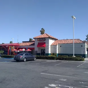 a parking lot with cars parked in it