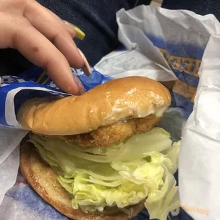 a chicken sandwich with lettuce