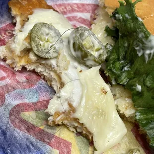 a piece of pizza with cheese and vegetables