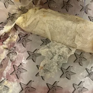 a burrito wrapped in wax paper