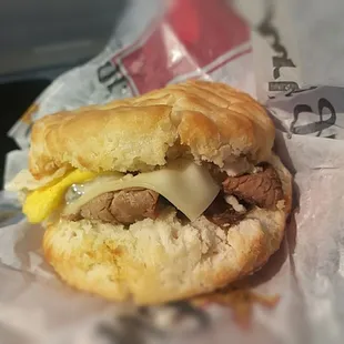 Slow cooked sliced prime rib, Swiss cheese, and a fresh-cracked fried egg on a buttermilk biscuit (580 cals).