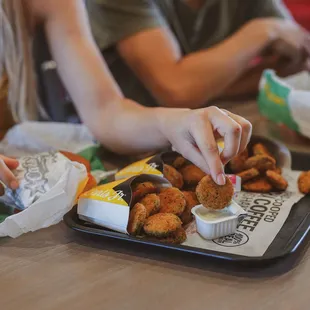 a tray of fried chicken nuggies