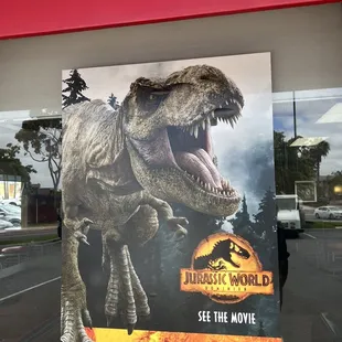 a poster of a t - rex