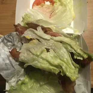 Messy scraps of a lettuce wrap.
