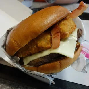 a burger with bacon and cheese