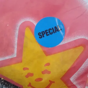 a pink bag with a yellow star on it