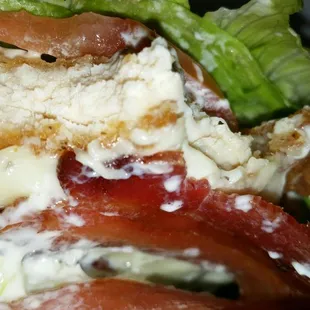 a sandwich with lettuce and bacon