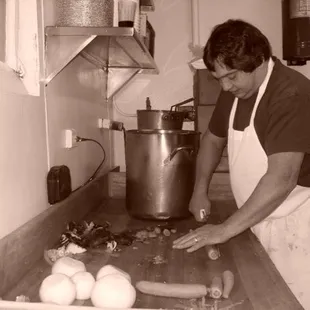 The owner John making his famous minestrone soup! Order a grilled cheese and dip it in this soup!