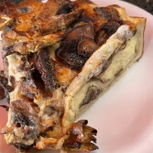 a slice of BRIE, ARTICHOKE, and MUSHROOM quiche