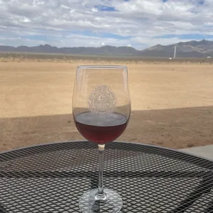 a glass of wine on a table