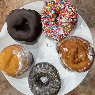 a variety of donuts on a plate