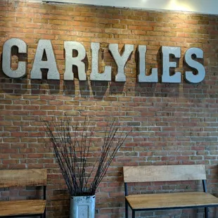 a brick wall and benches