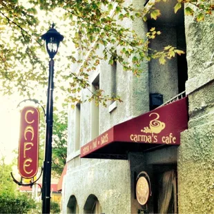 a red awning on the side of a building