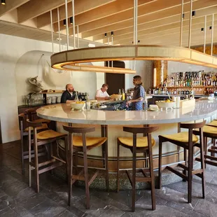 a bar with a large circular counter