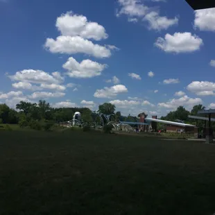 Splash pad children's play area across the open field