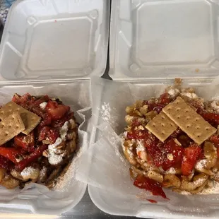 Custom Funnel Cakes - one with caramel, one with chocolate. Both with strawberries and graham crackers and joy