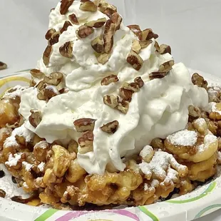 Carmel Coated Funnel Cake - our house favorite with chocolate and caramel drizzle, loaded with whipped cream and pecans
