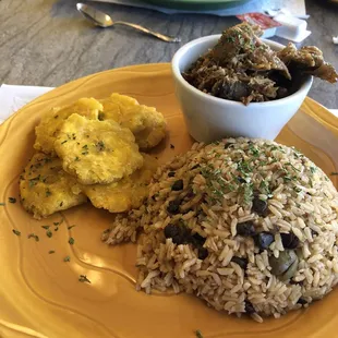 Roast Pork, rice with pigeon peas and tostones