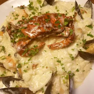 Seafood Risotto special at Carmela's! Creamy deliciousness with clams, mussels, shrimp, calamari and Mr. soft shell crab on top.