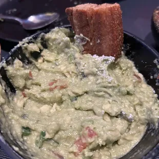 This is a delicious guacamole with sticks of pork belly! Soooo good...yum yum yum.
