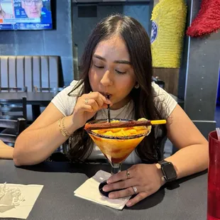 Wife enjoying a mangoneada margarita